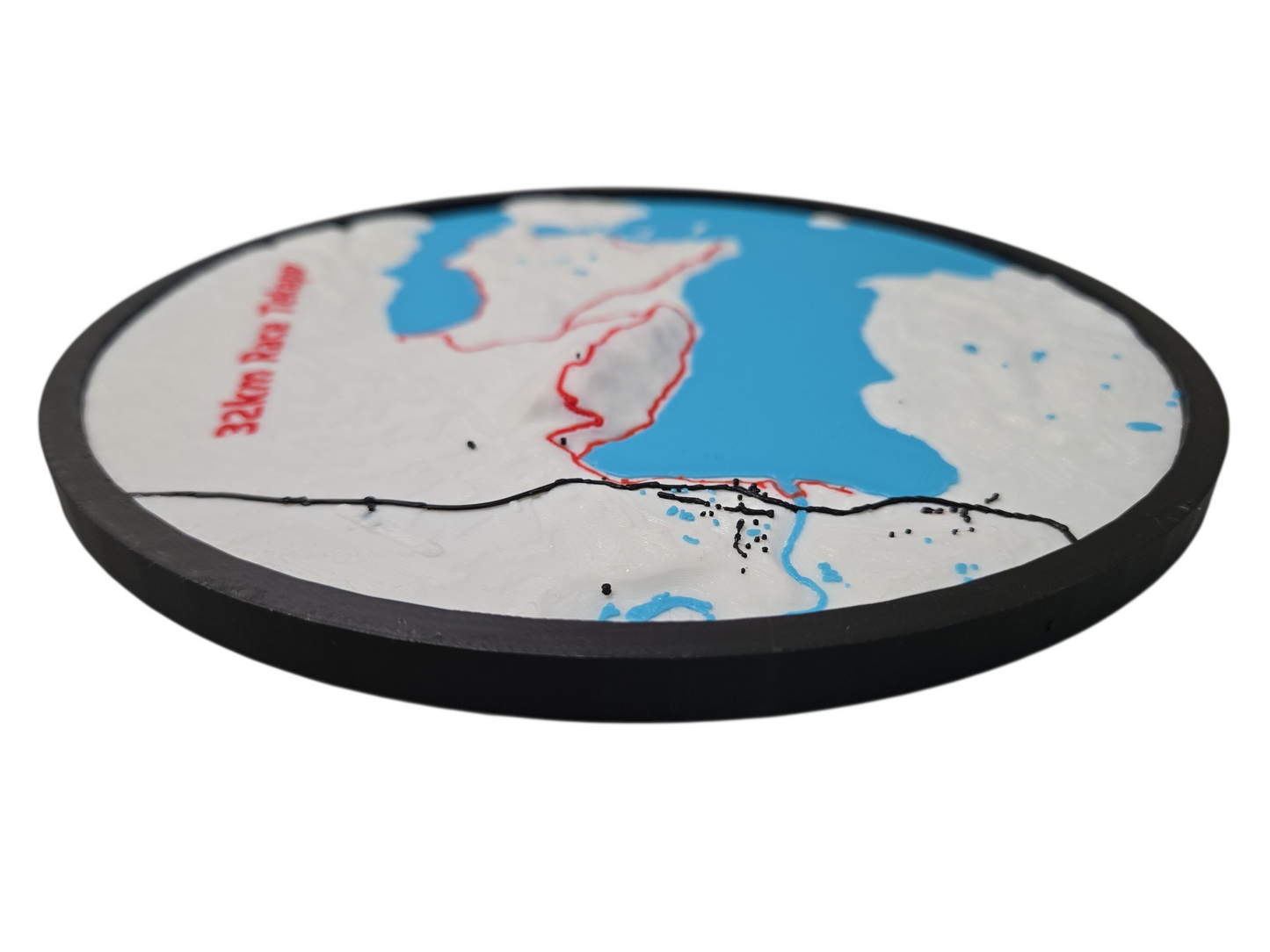 Round map coaster with a black border on a white background
