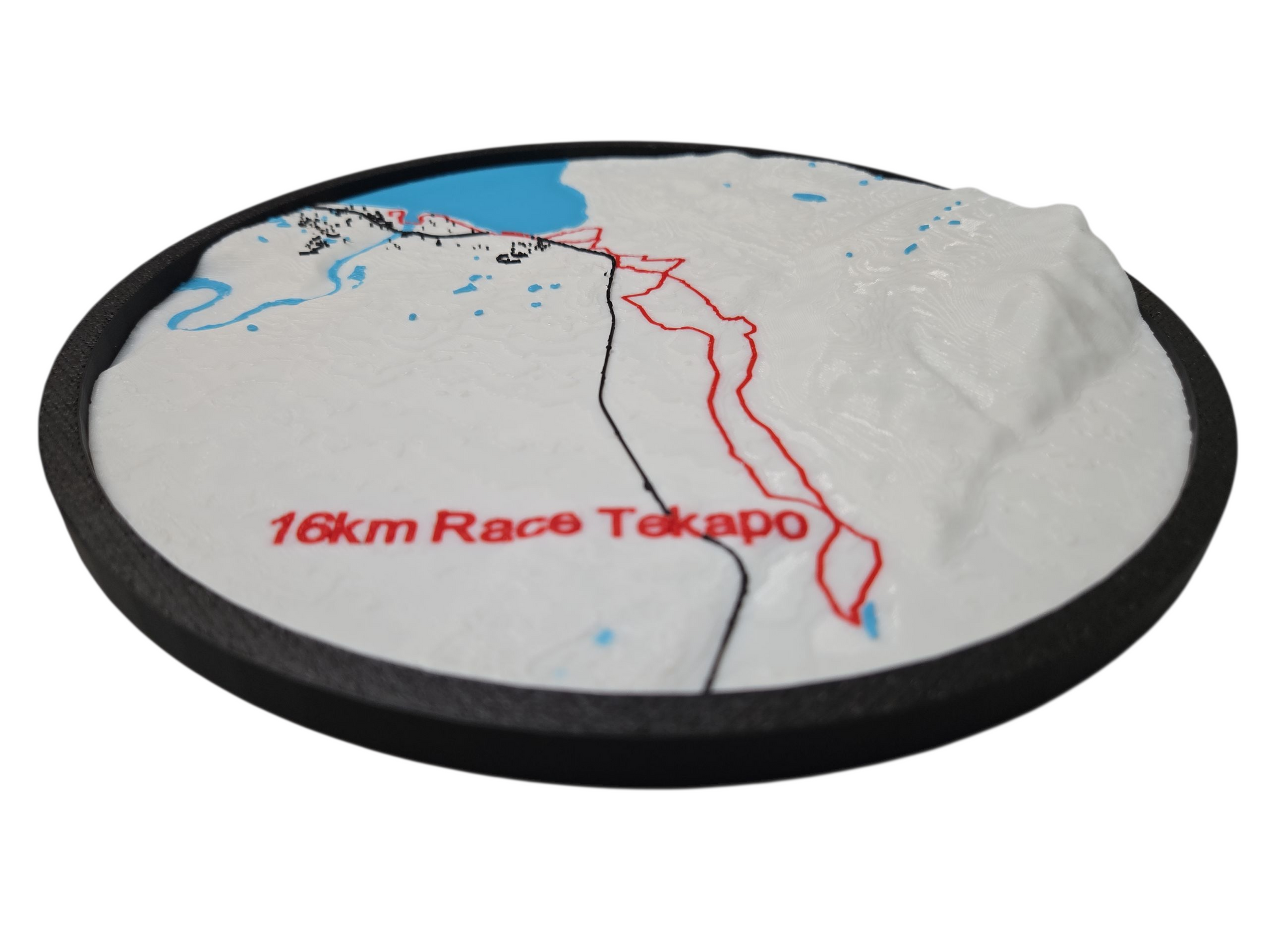Round mat with a map design and '16km Race Tekapo' text on a white background